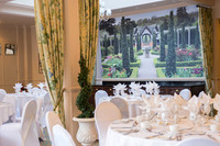 Reigate Manor Hotel / The wedding reception tables and decorations