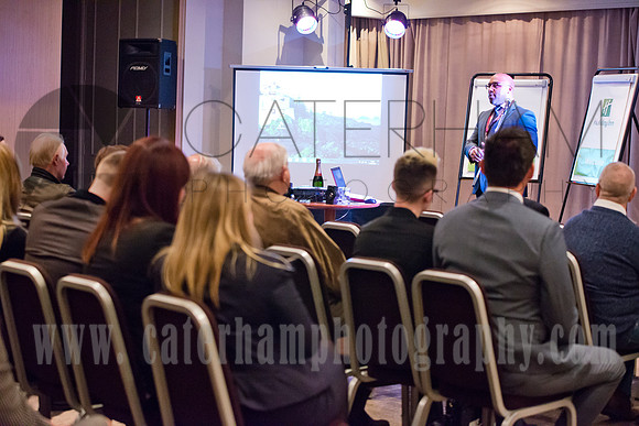 surrey wedding photographer-  man giving speak at business meeting