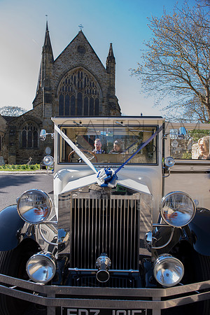 Wedding at St Mary Church in Horsham / The bride and the groom in the beautiful wedding car