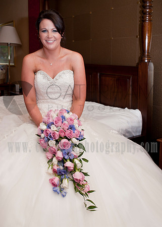 Surrey wedding photographer /Legacy Thatchers Hotel Wedding sitting on the bed waiting (5)