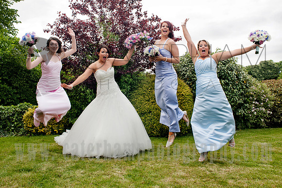 Surrey wedding photographer /Legacy Thatchers Hotel Wedding leaping for joy (12)