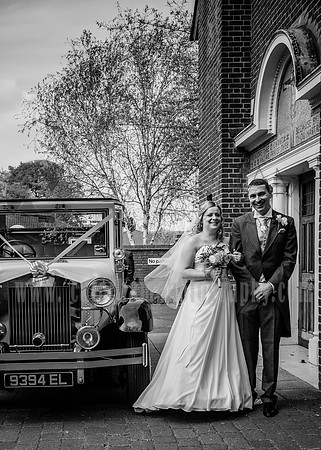 surrey wedding phtotgrapher-holy Cross Church in Carshalton- bride and groom with car