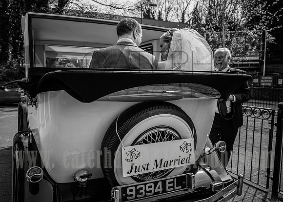 surrey wedding phtotgrapher-holy Cross Church in Carshalton- bride and groom in car