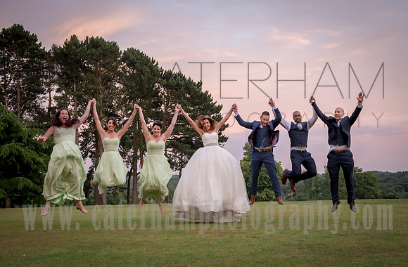 Surrey wedding photographer / selsdon park hotel wedding / The bride with bridesmaids and grooms-maids / 'jump photo'