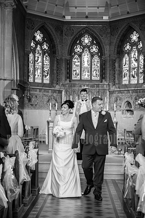 Surrey Wedding Photographer / Wedding in Caterham / The wedding couple walking through the church aisle / Black and white wedding photography