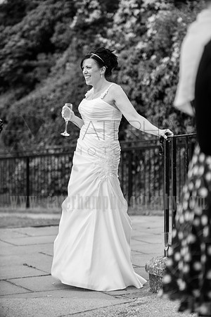 Surrey Wedding Photographer / Wedding in Caterham / The bride holding glass