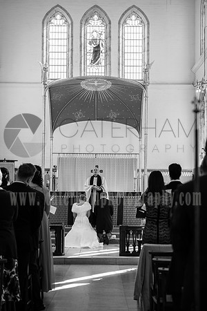 Surrey wedding photographer / St Johns Church Coulsdon Wedding / Bride and groom kneel at the altar / The wedding couple praying