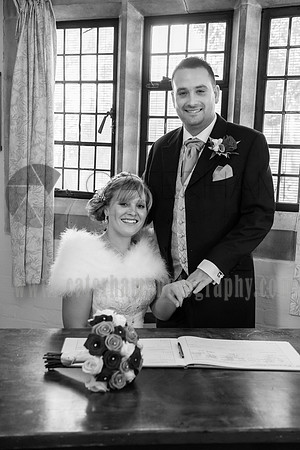 Surrey Wedding photographer / St Johns Church Coulsdon Wedding / The groom holding brides hand while she's sitting down