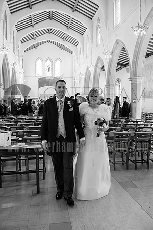 Surrey wedding photographer / St Johns Church Coulsdon Wedding / The bride and groom walking out of the church after the ceremony