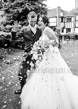 Surrey wedding photographer /Legacy Thatchers Hotel Weddings the confetti shower