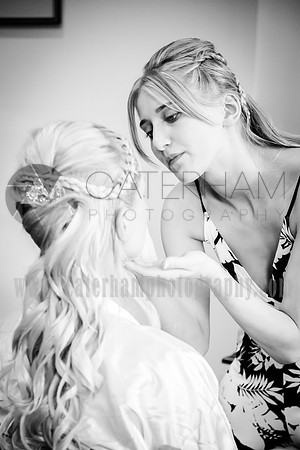 surrey wedding photographer- finishing the brides makeup- Bridal Preparation