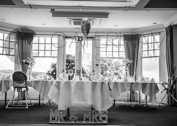 Surrey wedding photographer / Tyrrells Wood Golf Club Wedding / The wedding couples table / Wedding reception / Black and white wedding photos