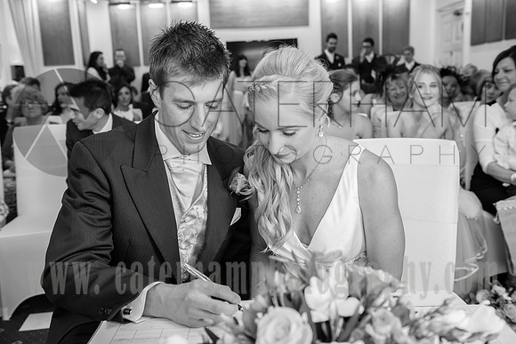 Surrey wedding photographer / Tyrrells Wood Golf Club Wedding / The wedding couple sitting at the table / Black and white wedding photos