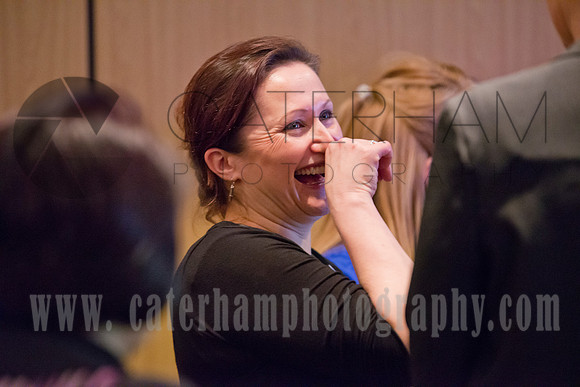Surrey event photographer- woman laughing at work meeting