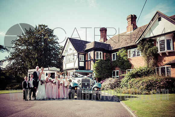 East Grinstead wedding photographer / yew lodge weddings / Family photo / The wedding couple with kids / Kids Bridesmaids and Grooms-maids / Old style wedding car