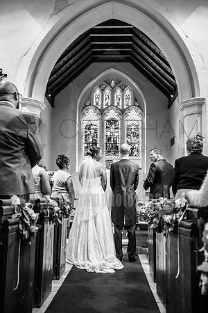 surrey wedding photographer- chaldon church- bride and groom at the aisle