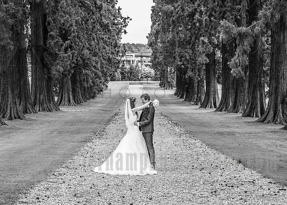 Surrey wedding photographer- bride and groom hugging ooutside