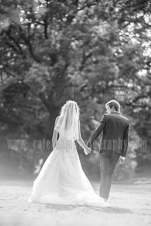 Surrey wedding photographer- bride and groom walking