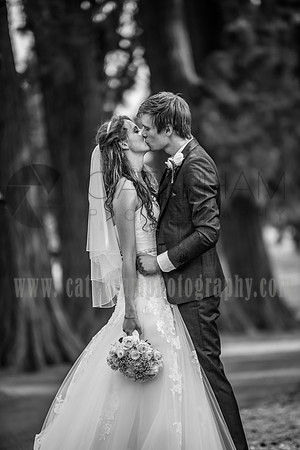 surrey wedding photographer- kissing in black and white