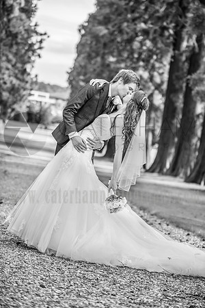 Surrey wedding photographer- bride and groom hugging and kissing