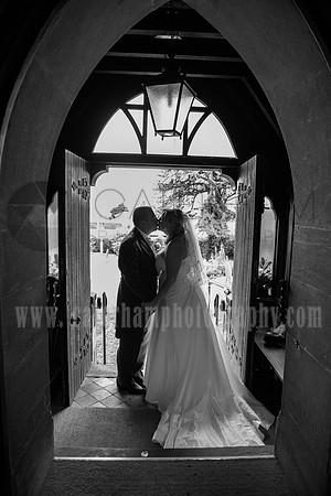 Kent wedding photographer / St Mary's Church Ide Hill Wedding / The wedding couple kiss t the church door