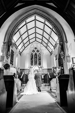 Kent wedding photographer / St Mary's Church Ide Hill Wedding / The back view on the wedding couple at the altar