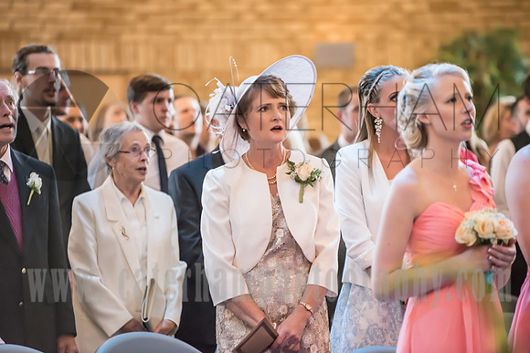 surrey wedding photographer / reigate baptist church (26) / The guests singing in the church during the ceremony