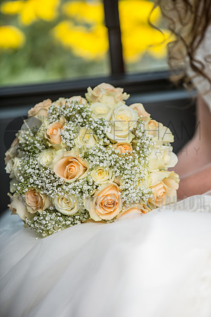 Surrey wedding photograper / reigate baptist church (29) / The wedding bouquet laying on brides laps
