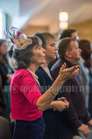 Surrey wedding photographer / reigate baptist church (3) / The guests singing on the wedding ceremony - close shoot