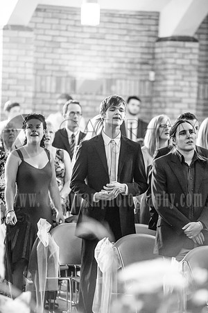 Surrey wedding photographer / reigate baptist church (4) / Guests singing during the wedding ceremony