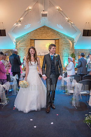 Surrey wedding photographer / reigate baptist church (6) / The wedding couple walking down the church aisle