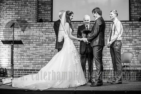Surrey wedding photography / reigate baptist church (12) / The groom and bride making the vows at the altar