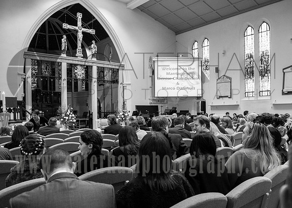 Surrey wedding photographer / Wedding at St Paul’s Church in Addlestone / guests waiting in the church / black and white wedding photography
