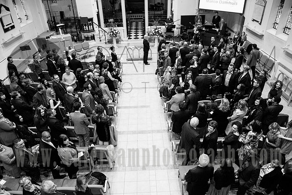 Surrey wedding photographer / Wedding at St Paul’s Church in Addlestone / The groom and guests looking at the bride arriving to the altar