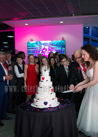 Surrey wedding photographer / mercedes benz world weddings (6) / The bride and groom cutting the wedding cake