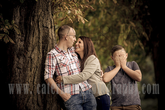 Surrey wedding Photographer Pre wedding shoot (16) /  Couple hugging and leaning on the tree / Funny family photos