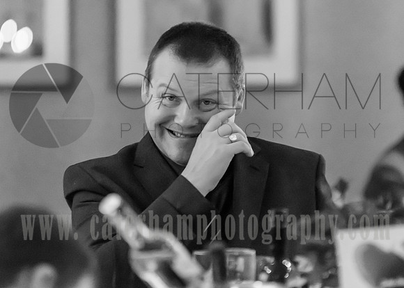 wedding photographers warlingham /  farleigh golf club weddings (9) / The guest by the table smiling