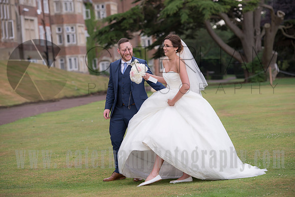 Surrey wedding photographer / selsdon park hotel wedding bride showing her shoes 19