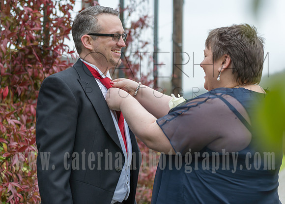 Surrey wedding photographer / wedding photographers warlingham farleigh golf club weddings (5) / Grooms mum doing his tie