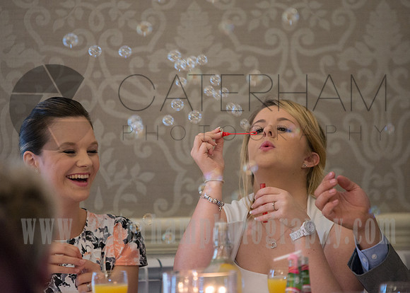 surrey wedding photographer- Crowhurst Park Wedding East Sussex- blowing bubbles