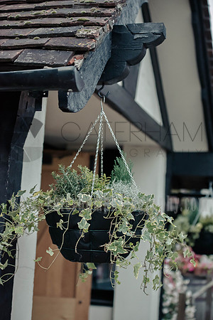 Surrey wedding photographer / The Red Barn Wedding reception (32) / The flower by the reception