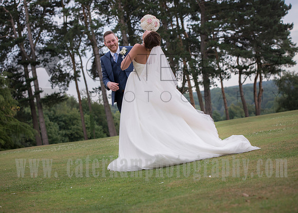 Surrey wedding photographer / selsdon park hotel wedding bride hiding behind her bouquet 20