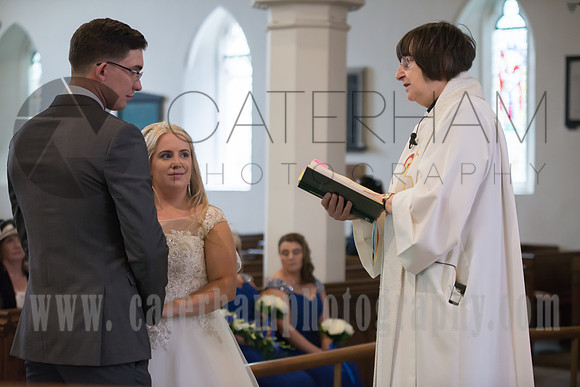 Surrey wedding photographer godstone church wedding Groom and Braid during the wedding ceremony at the altar