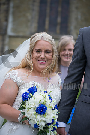 Surrey wedding photographer godstone church wedding The bride with bouquet holing hand of her husband