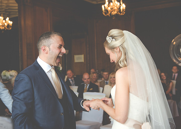 Surrey Wedding Photographer- Nutfield Priory- Giving of the rings 15
