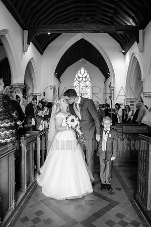Surrey wedding photographer godstone church wedding The bride and groom kiss