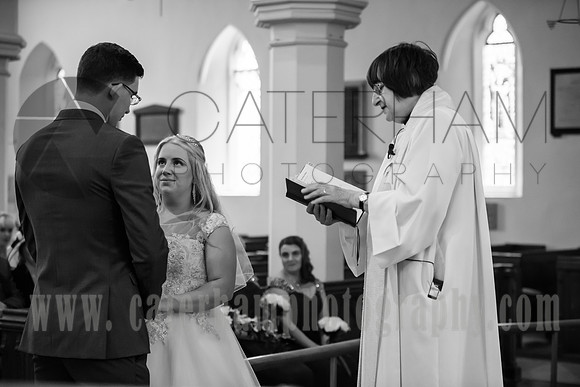 Surrey wedding photographer godstone church wedding Bride and groom looking in eyes in the wedding ceremony