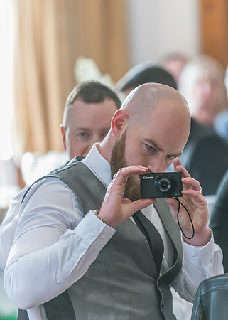 Surrey wedding photographer- westerham golf club wedding- wedding guest with camera