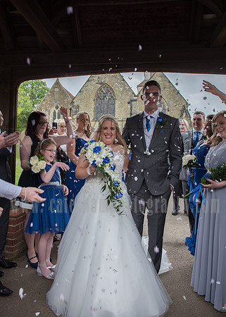 Surrey wedding photographer godstone church wedding petals of flowers thrown at new married couple