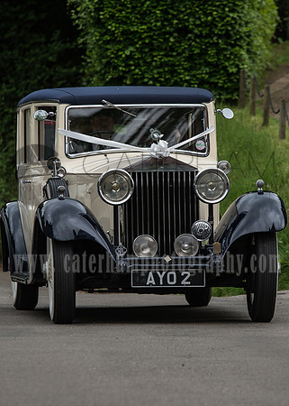 Surrey wedding photographer godstone church wedding Old style wedding cars.